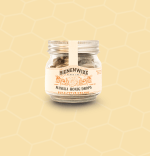 Bienenwixe Manuka Honig Drops mit Eukalyptus und Orange in einem Glasbehälter.